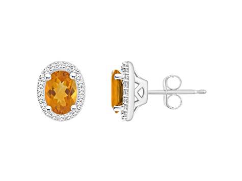 7x5mm Oval Citrine 1/5 ctw Diamond Rhodium Over Sterling Silver Halo Stud Earrings