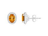 7x5mm Oval Citrine 1/5 ctw Diamond Rhodium Over Sterling Silver Halo Stud Earrings