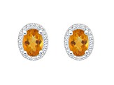 7x5mm Oval Citrine 1/5 ctw Diamond Rhodium Over Sterling Silver Halo Stud Earrings