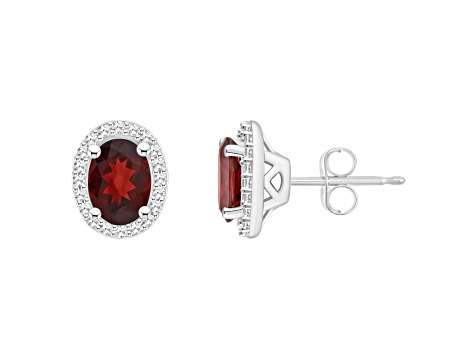 7x5mm Oval Garnet 1/5 ctw Diamond Rhodium Over Sterling Silver Halo Stud Earrings