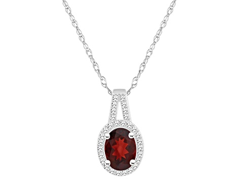 8x6mm Oval Garnet 1/7 ctw Diamond Rhodium Over Sterling Silver Halo Pendant with Chain