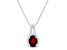 8x6mm Oval Garnet 1/7 ctw Diamond Rhodium Over Sterling Silver Halo Pendant with Chain