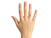 8x6mm Emerald Cut Peridot And White Topaz Accents Rhodium Over Sterling Silver Halo Ring