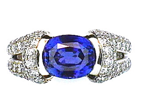 Oval Blue Sapphire and White Diamond Platinum Ring. 4.43 CTW