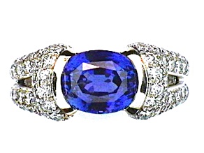Oval Blue Sapphire and White Diamond Platinum Ring. 4.43 CTW