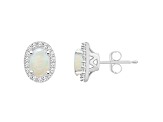 6x4mm Oval Opal 1/6 ctw Diamond Rhodium Over Sterling Silver Halo Stud Earrings