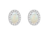 6x4mm Oval Opal 1/6 ctw Diamond Rhodium Over Sterling Silver Halo Stud Earrings