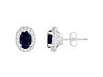 6x4mm Oval Sapphire 1/6 ctw Diamond Rhodium Over Sterling Silver Halo Stud Earrings