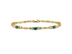 10k Yellow Gold and Rhodium Over 10k Yellow Gold Diamond and Emerald Bracelet