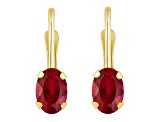 6x4mm Oval Created Ruby 10k Yellow Gold Drop Earrings