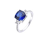 Lab Created Blue Sapphire and White Topaz Rhodium Over Sterling Silver Ring
