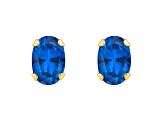 6x4mm Oval Created Sapphire 10k Yellow Gold Stud Earrings