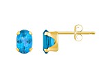 6x4mm Oval Blue Topaz 10k Yellow Gold Stud Earrings