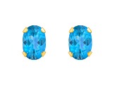 6x4mm Oval Blue Topaz 10k Yellow Gold Stud Earrings