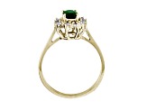 0.61ctw Oval Emerald and Diamond Halo Ring in 14k Yellow Gold