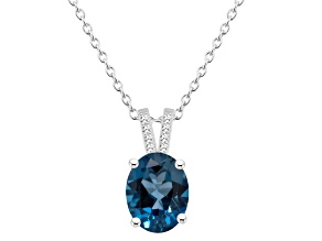 10x8mm Oval London Blue Topaz With Diamond Accents Rhodium Over Sterling Silver Pendant with Chain