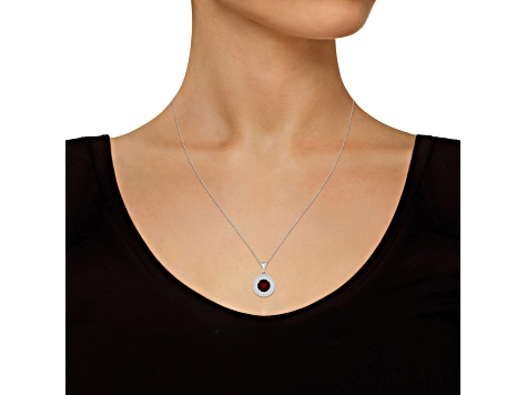 7mm Round Garnet And White Topaz Accent Rhodium Over Sterling Silver Double Halo Pendant w/Chain