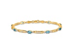 10k Yellow Gold and Rhodium Over 10k Yellow Gold Diamond and Blue Topaz Bracelet