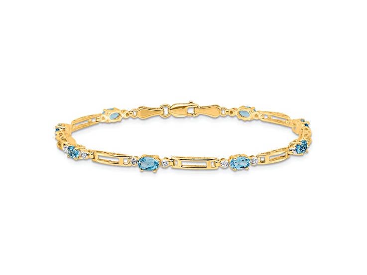 10k Yellow Gold and Rhodium Over 10k Yellow Gold Diamond and Blue Topaz Bracelet