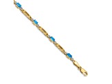 10k Yellow Gold and Rhodium Over 10k Yellow Gold Diamond and Blue Topaz Bracelet