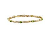 10k Yellow Gold and Rhodium Over 10k Yellow Gold Diamond and Peridot Bracelet