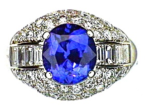 Oval Blue Sapphire and White Diamond Platinum Ring. 5.85 CTW