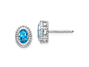 Rhodium Over 10k White Gold 1.12ctw Oval Blue Topaz December Birthstone Stud Earrings