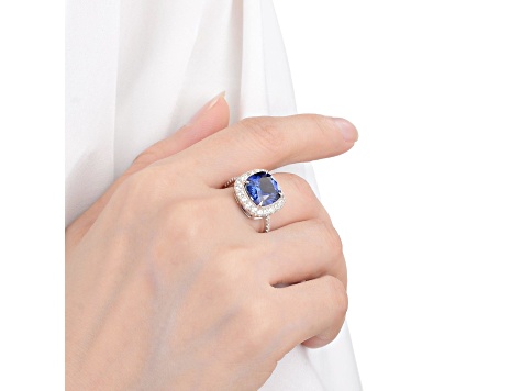 Lab Created Blue Sapphire and White Topaz Rhodium Over Sterling Silver Halo Ring