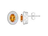 6x4mm Oval Citrine 1/5 ctw Diamond Rhodium Over Sterling Silver Halo Stud Earrings