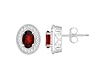 6x4mm Oval Garnet 1/5 ctw Diamond Rhodium Over Sterling Silver Halo Stud Earrings