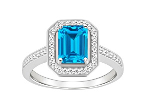 8x6mm Emerald Cut Blue Topaz 1/5 ctw Diamond Rhodium Over Sterling Silver Halo Ring