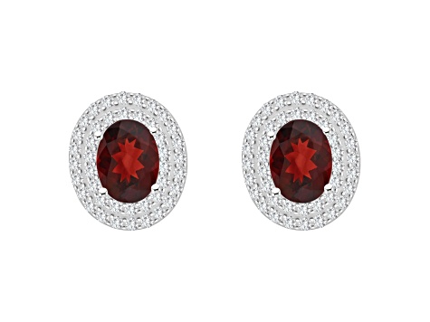 8x6mm Oval Garnet And White Topaz Accent Rhodium Over Sterling Silver Double Halo Stud Earrings