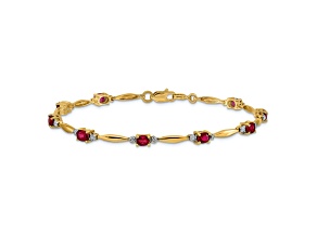 10k Yellow Gold and Rhodium Over 10k Yellow Gold Diamond and Oval Ruby Bracelet