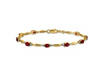 10k Yellow Gold and Rhodium Over 10k Yellow Gold Diamond and Oval Ruby Bracelet