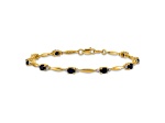 10k Yellow Gold and Rhodium Over 10k Yellow Gold Diamond and Oval Sapphire Bracelet