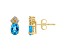 6x4mm Oval Blue Topaz with Diamond Accents 14k Yellow Gold Stud Earrings