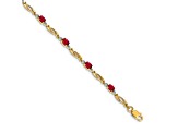 14k Yellow Gold and Rhodium Over 14k Yellow Gold Diamond and Oval Ruby Bracelet