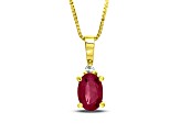 0.55ctw Oval Ruby and Round White Diamond Accent Pendant in 14k Yellow Gold
