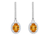 7x5mm Oval Citrine 1/3 ctw Diamond Rhodium Over Sterling Silver Halo Dangle Earrings