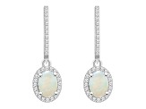 7x5mm Oval Opal 1/3 ctw Diamond Rhodium Over Sterling Silver Halo Dangle Earrings