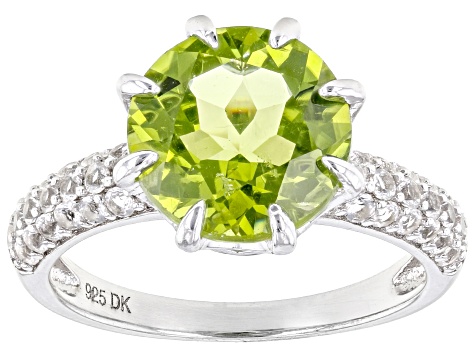 Silver Sterling Green Olivine Ring Holding Peridot Gems And Finished With Rhodium.