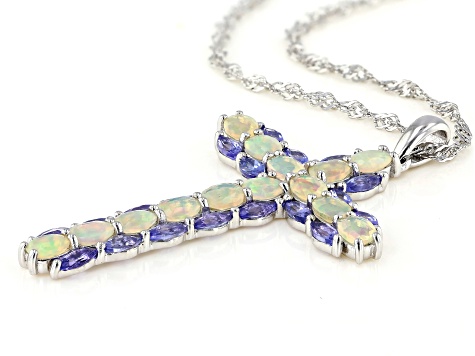 Blue tanzanite rhodium over sterling silver cross pendant with chain 2.55ctw