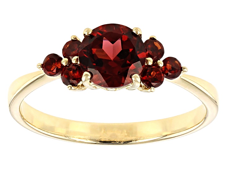 Ring offers solid 10K yellow gold with small diamonds and i think garnet