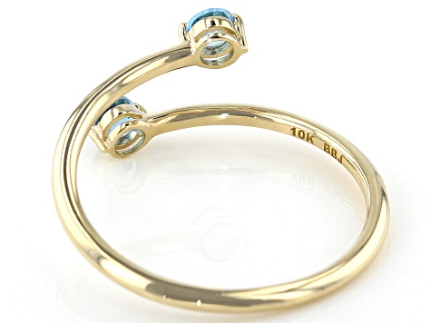 Swiss Blue Topaz 10k Yellow Gold Bypass Ring .29ctw