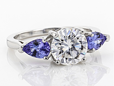 Moissanite Fire® 1.90ct DEW Round And .78ctw Pear Shape Tanzanite Platineve™ Ring