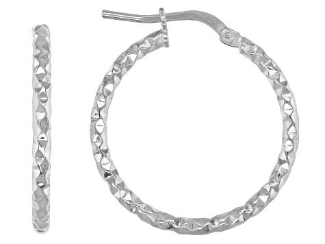 Rhodium over bronze hoop earrings.