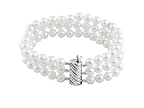 White 5-6mm triple row freshwater pearl bracelet with a sterling silver clasp, 7"