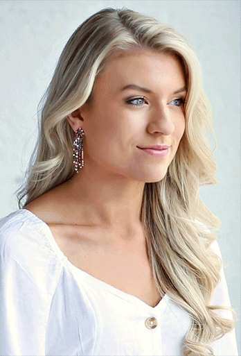 Woman wearing dangle earrings