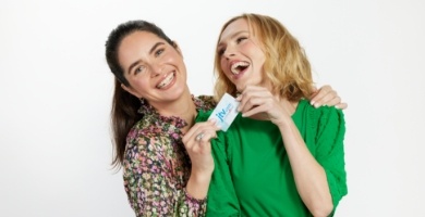 ladies laughing holding gift card
