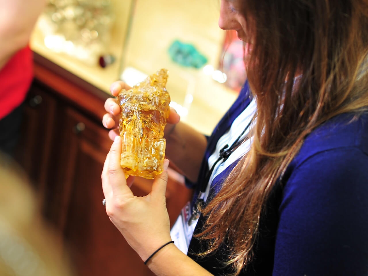 Woman holding gemstone specimen